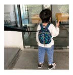 Children's anti-loss safety backpack with dinosaur-shaped safety belt.