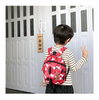 Children's anti-loss safety backpack with dinosaur-shaped safety belt.